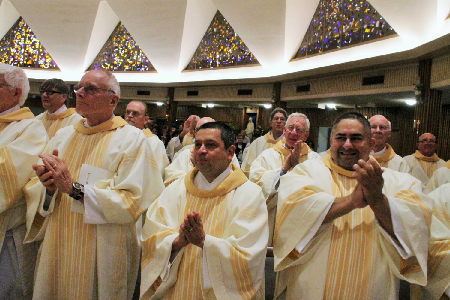 Permanent deacons of the Jefferson City diocese rejoice at the ordination of a group of fellow deacons in 2019.